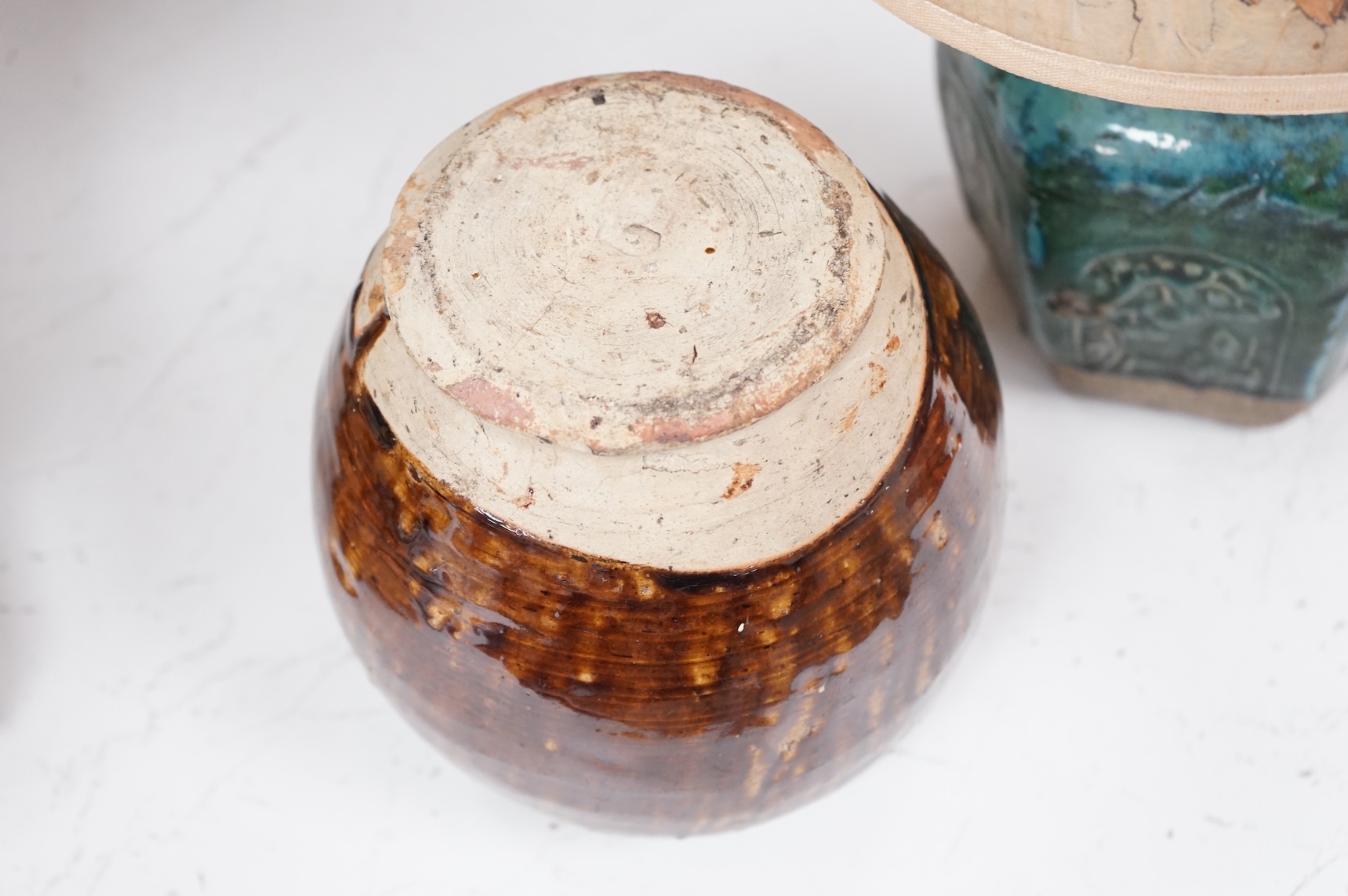 Two Chinese glazed pots, one converted as a lamp with a pressed floral shade, largest overall 37cm high
